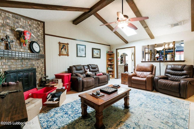 4610 63rd St, Lubbock, TX 79414 - living room with a ceiling fan, a brick fireplace, a chandelier, and a textured ceiling
