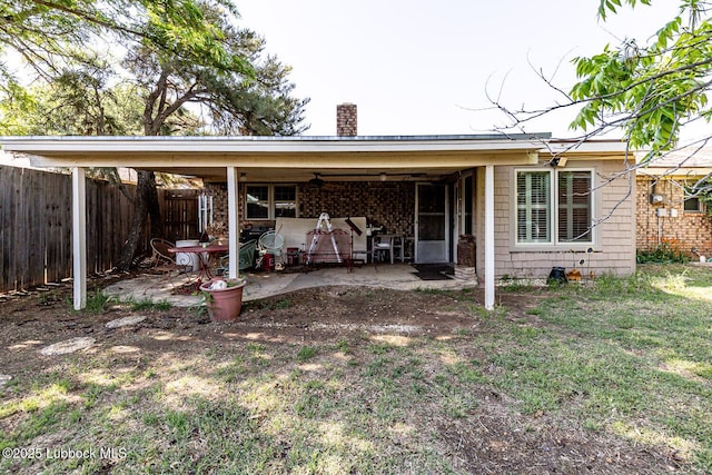 4610 63rd St, Lubbock, TX 79414 - rear view of house with a chimney, a patio area, and a ceiling fan