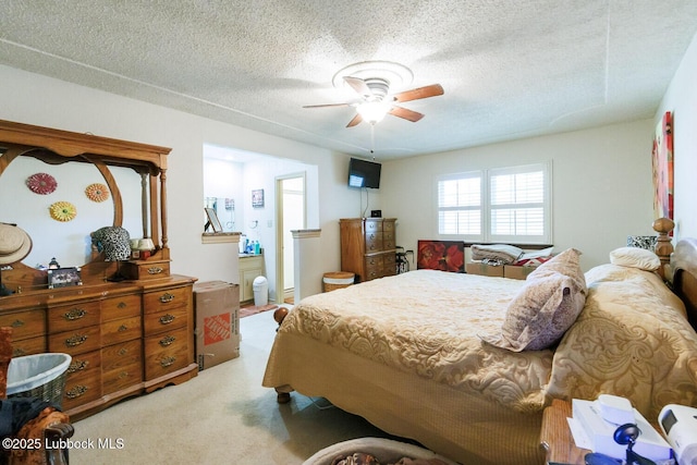 4610 63rd St, Lubbock, TX 79414 - bedroom with light carpet, a textured ceiling, and ceiling fan