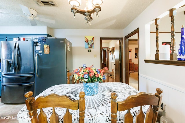 4610 63rd St, Lubbock, TX 79414 - dining space with a chandelier and a textured ceiling