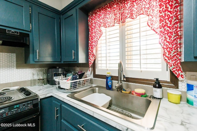 4610 63rd St, Lubbock, TX 79414 - kitchen featuring range, light countertops, range hood, tasteful backsplash, and blue cabinets