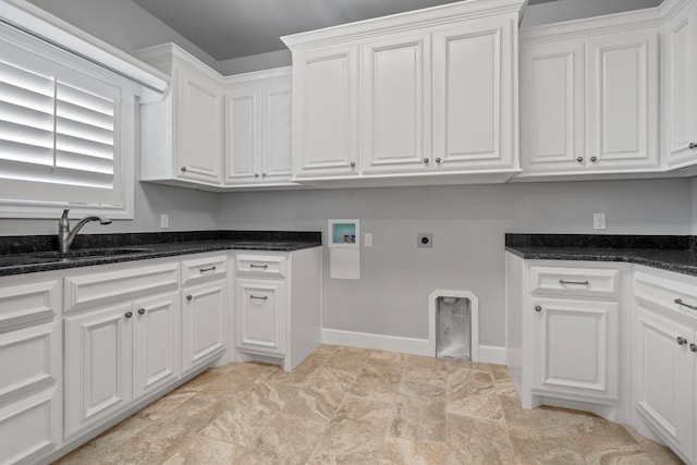 clothes washing area with cabinets, washer hookup, sink, and electric dryer hookup