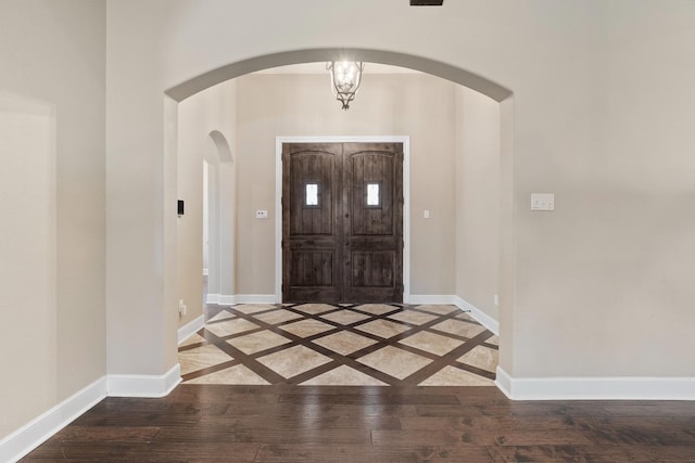 foyer entrance featuring wood-type flooring