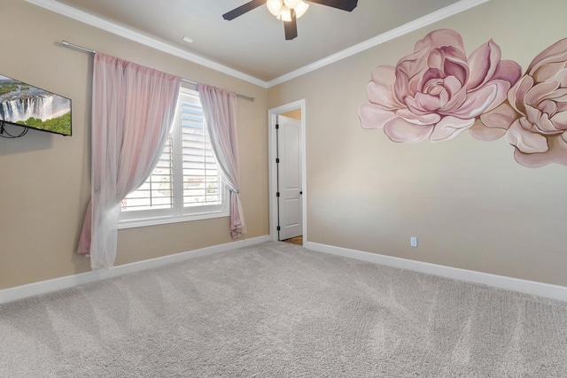 unfurnished room featuring ornamental molding, ceiling fan, and carpet