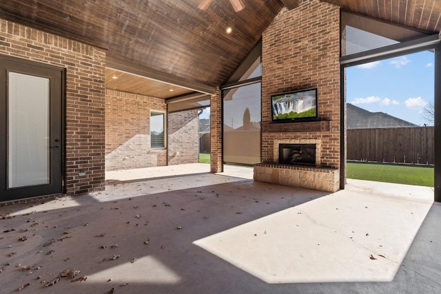 view of patio featuring an outdoor brick fireplace