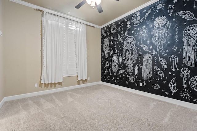 empty room with ornamental molding, carpet floors, and ceiling fan