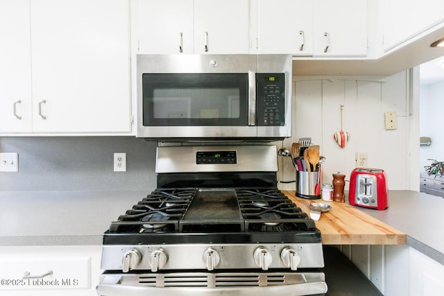 2806 58th St, Lubbock, TX 79413 - kitchen with stainless steel appliances, light countertops, and white cabinetry