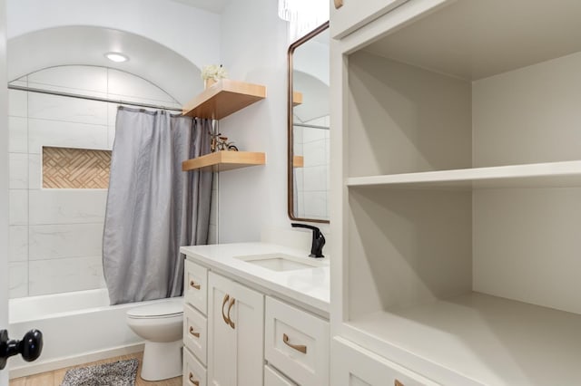 full bathroom featuring vanity, toilet, and shower / tub combo