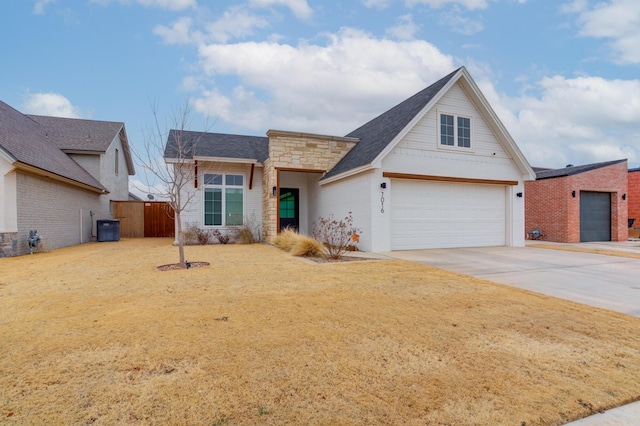 view of front of home featuring a garage and central AC