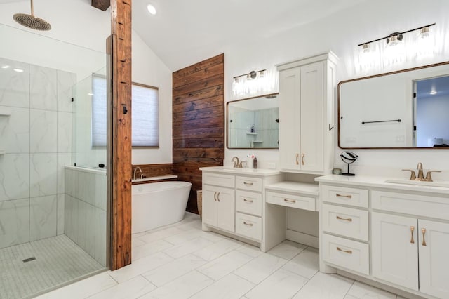 bathroom with lofted ceiling, independent shower and bath, and vanity