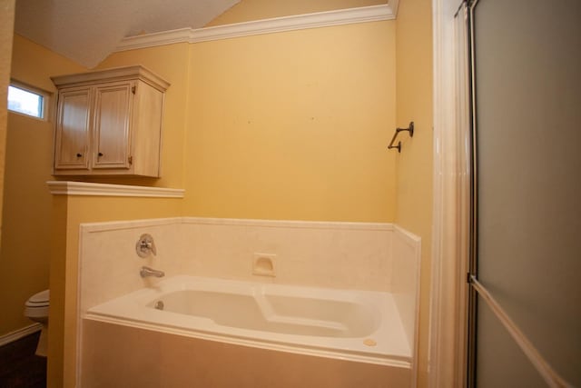 bathroom with lofted ceiling, a textured ceiling, plus walk in shower, and toilet