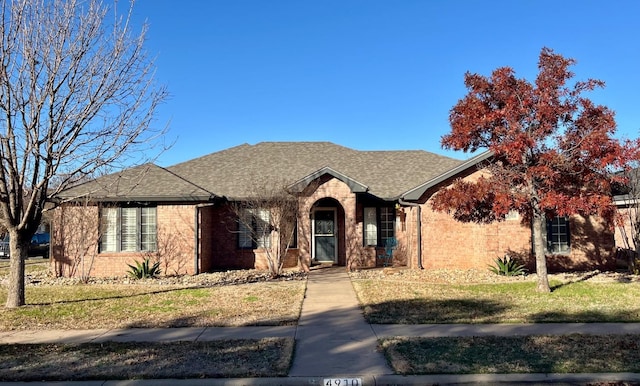 ranch-style home with a front yard