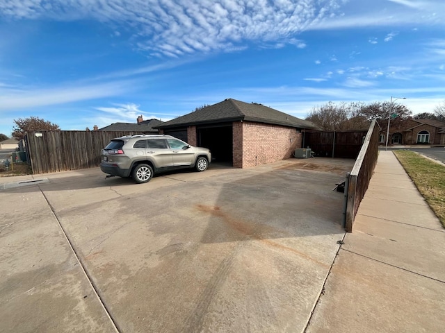 view of side of home with a garage