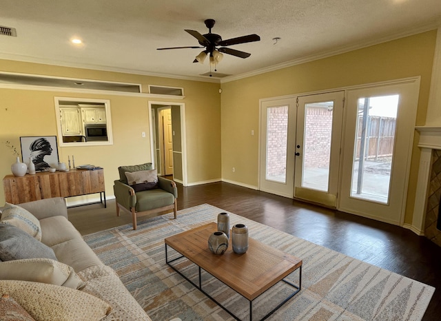 4910 102nd St, Lubbock, TX 79424 - living area with crown molding, dark wood finished floors, a ceiling fan, and recessed lighting