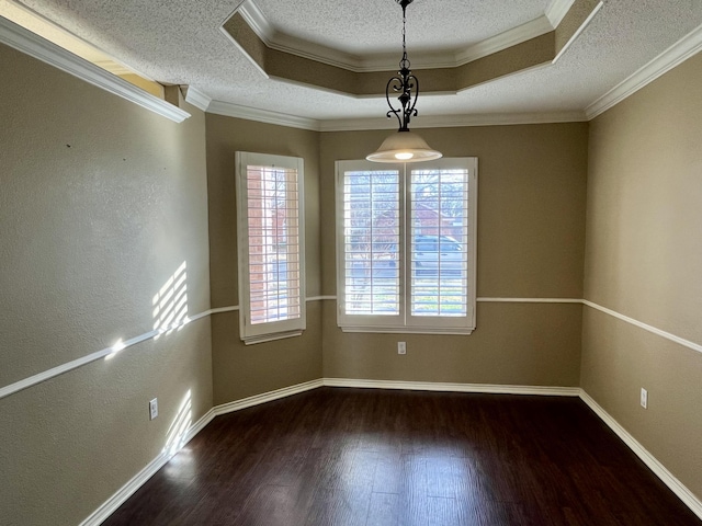 4910 102nd St, Lubbock, TX 79424 - spare room with wood finished floors, a textured ceiling, crown molding, and a tray ceiling