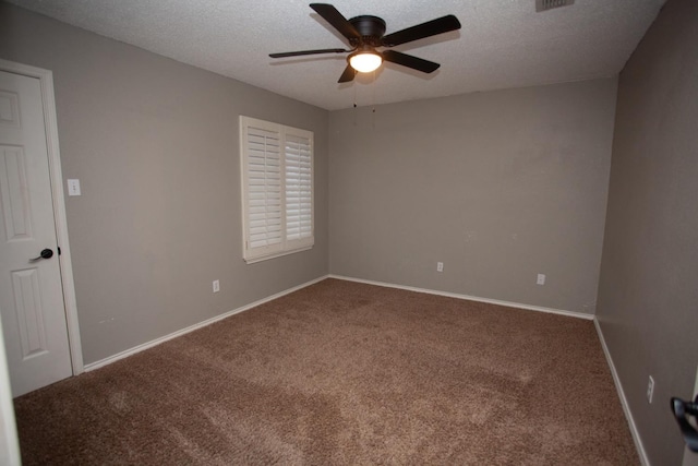 unfurnished room with ceiling fan, carpet, and a textured ceiling