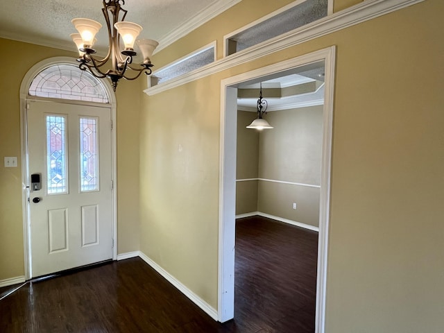 4910 102nd St, Lubbock, TX 79424 - entrance foyer featuring dark wood finished floors, ornamental molding, and a chandelier