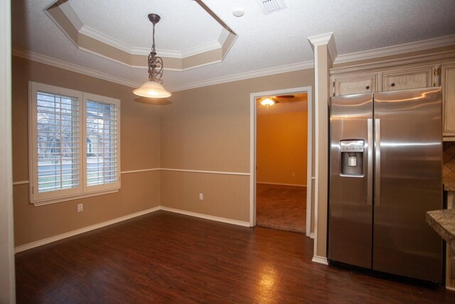 interior space with a raised ceiling, crown molding, and dark hardwood / wood-style flooring