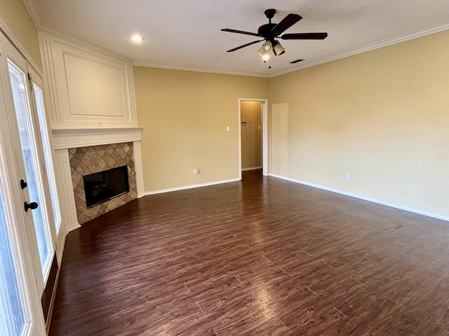 4910 102nd St, Lubbock, TX 79424 - unfurnished living room with dark wood-type flooring, a ceiling fan, a fireplace, crown molding, and recessed lighting