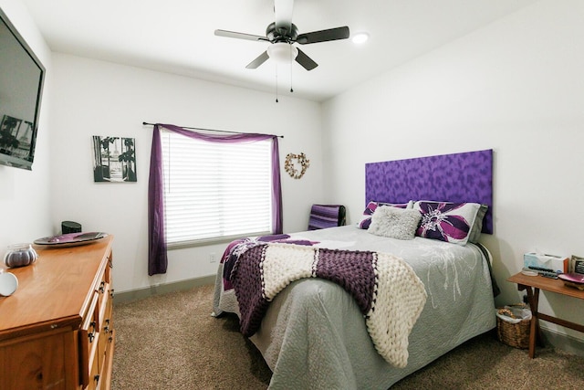 carpeted bedroom with baseboards and a ceiling fan