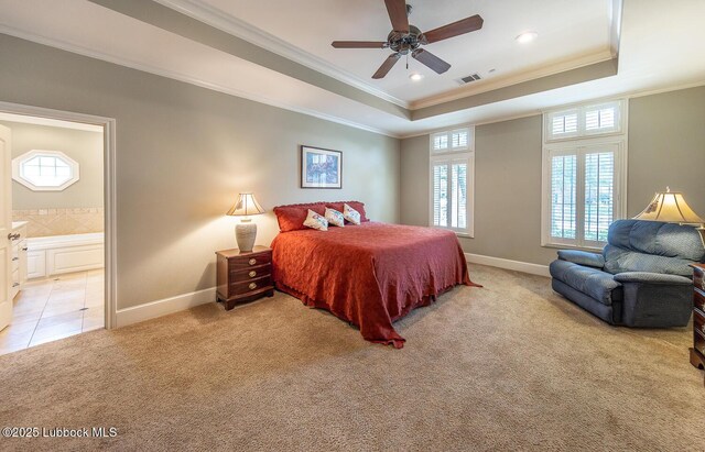 3914 101st St, Lubbock, TX 79423 - bedroom featuring a tray ceiling, crown molding, light carpet, recessed lighting, and connected bathroom