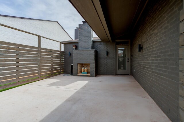3711 128th St, Lubbock, TX 79423 - view of patio with an outdoor brick fireplace