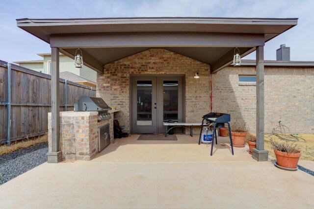 3711 128th St, Lubbock, TX 79423 - view of patio featuring french doors and exterior kitchen
