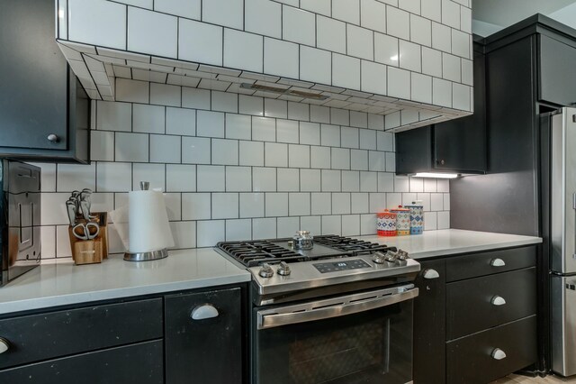 3711 128th St, Lubbock, TX 79423 - kitchen featuring gas range, decorative backsplash, freestanding refrigerator, and light countertops