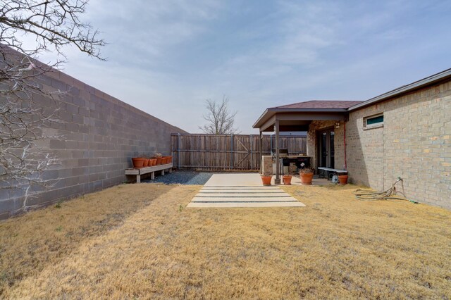 3711 128th St, Lubbock, TX 79423 - fenced backyard with a patio