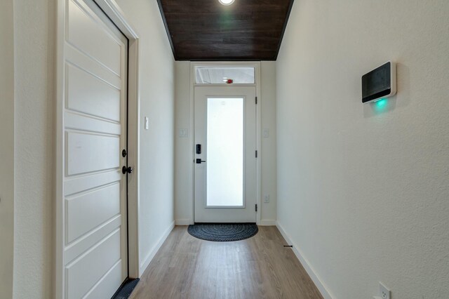 3711 128th St, Lubbock, TX 79423 - doorway featuring light wood-style floors and baseboards