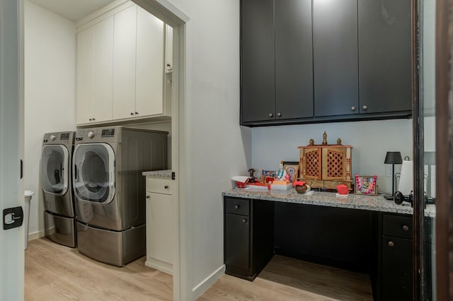 3711 128th St, Lubbock, TX 79423 - laundry room featuring independent washer and dryer, light wood finished floors, and cabinet space