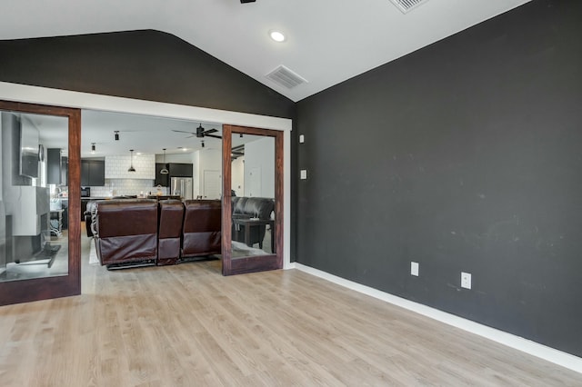 3711 128th St, Lubbock, TX 79423 - empty room featuring a ceiling fan, lofted ceiling, light wood-style flooring, and recessed lighting