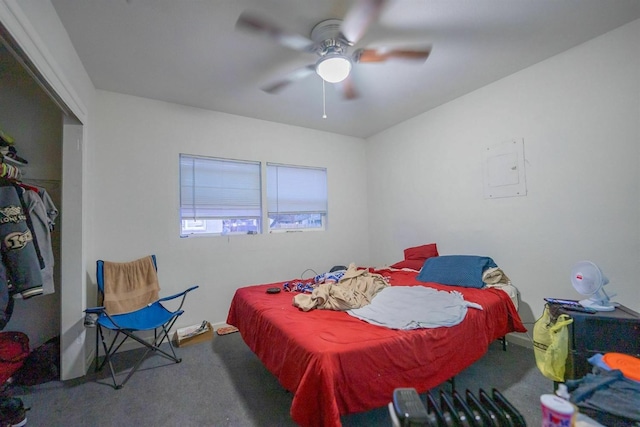 bedroom featuring ceiling fan and carpet