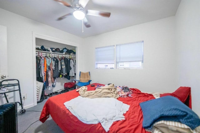 carpeted bedroom featuring a closet and ceiling fan