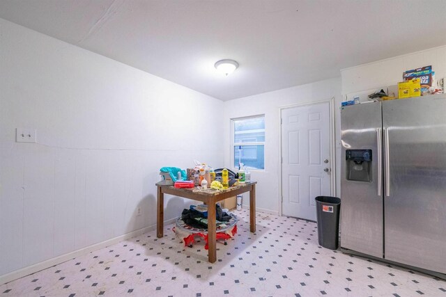 kitchen featuring stainless steel fridge with ice dispenser