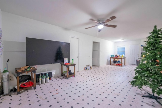 interior space featuring ceiling fan