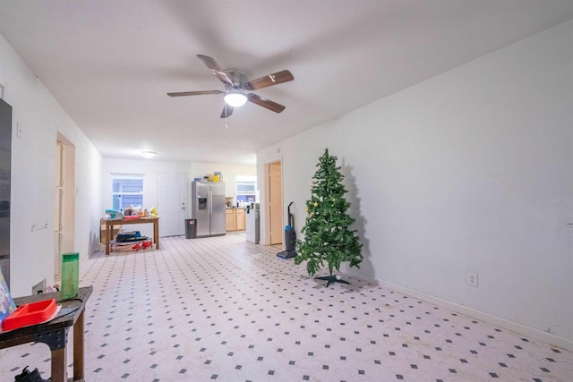 interior space with ceiling fan