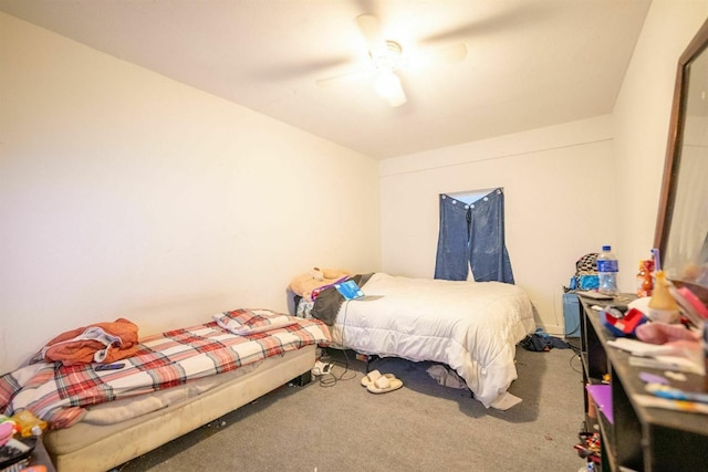 bedroom featuring ceiling fan and carpet