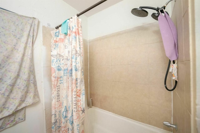 bathroom with shower / bathtub combination with curtain