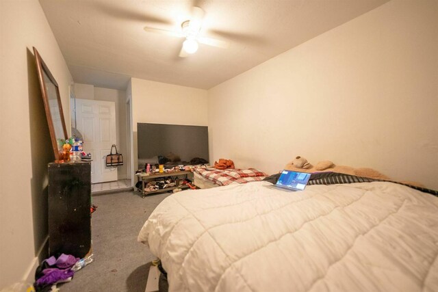 bedroom with ceiling fan and carpet flooring