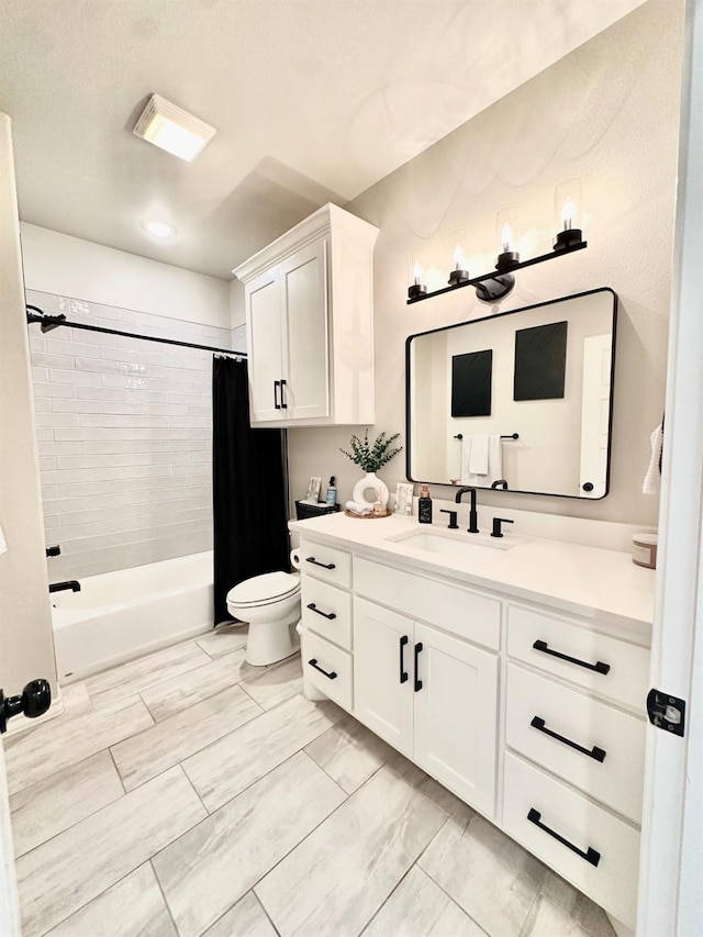 full bathroom featuring vanity, shower / bath combo, and toilet