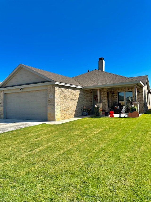 single story home with a garage and a front yard