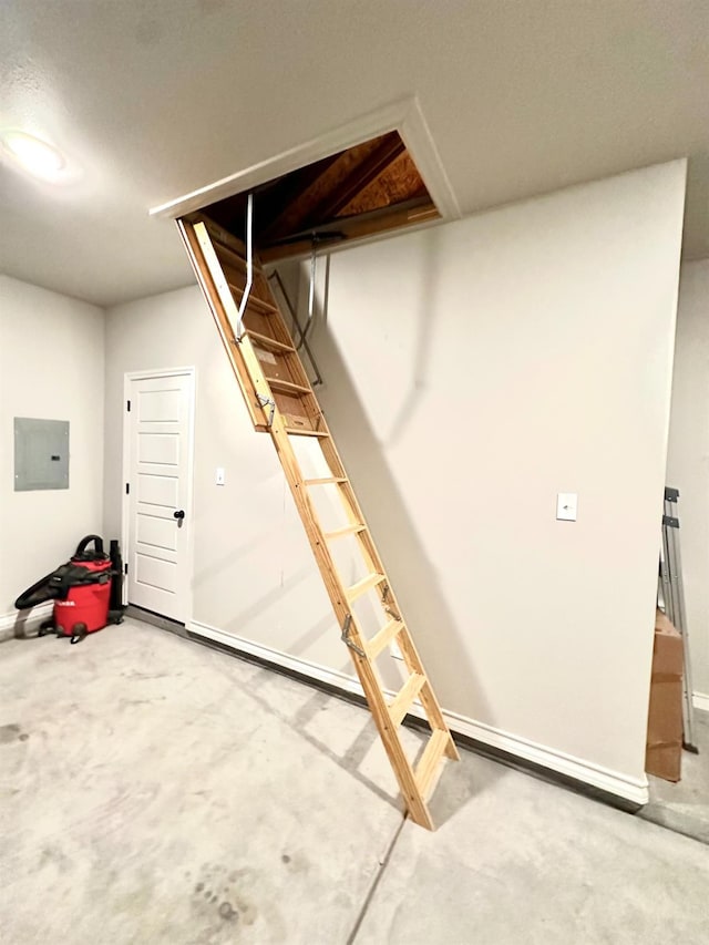 basement with carpet flooring and electric panel