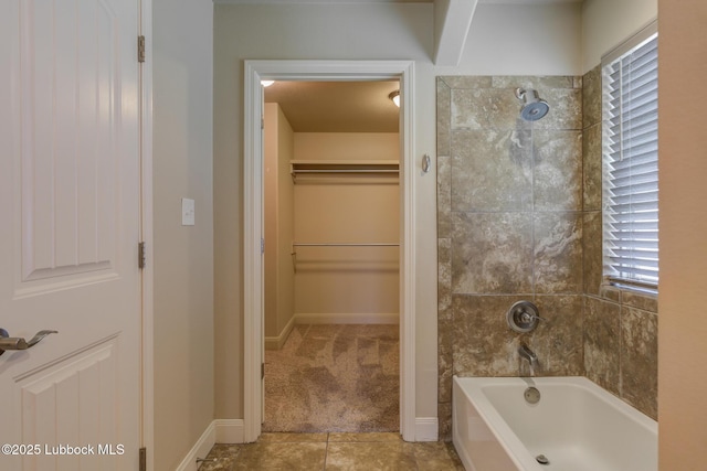 5207 Jarvis St, Lubbock, TX 79416 - full bathroom with tile patterned flooring, a spacious closet, and baseboards