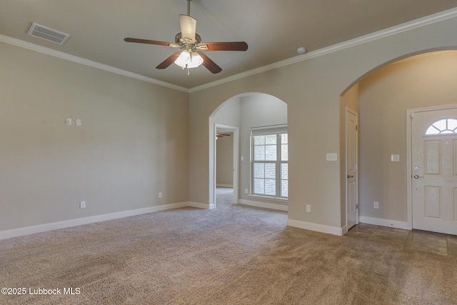 5207 Jarvis St, Lubbock, TX 79416 - carpeted spare room with arched walkways, healthy amount of natural light, ceiling fan, and ornamental molding