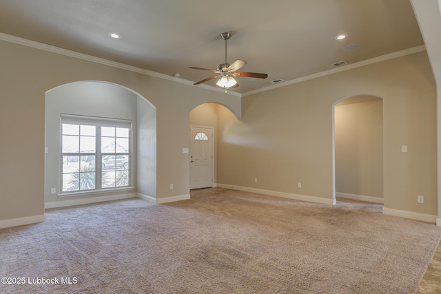 5207 Jarvis St, Lubbock, TX 79416 - spare room featuring a ceiling fan, arched walkways, crown molding, light colored carpet, and baseboards