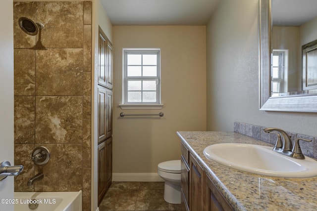5207 Jarvis St, Lubbock, TX 79416 - bathroom featuring vanity, toilet, tile patterned flooring, shower / bathtub combination, and baseboards