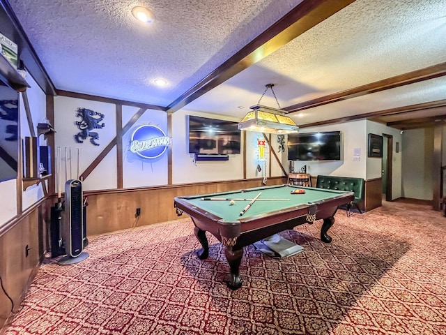 recreation room featuring billiards, wood walls, carpet, a textured ceiling, and beam ceiling