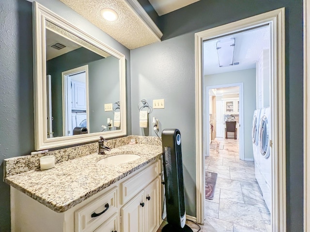 bathroom featuring vanity and a textured ceiling