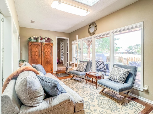 sunroom featuring a skylight